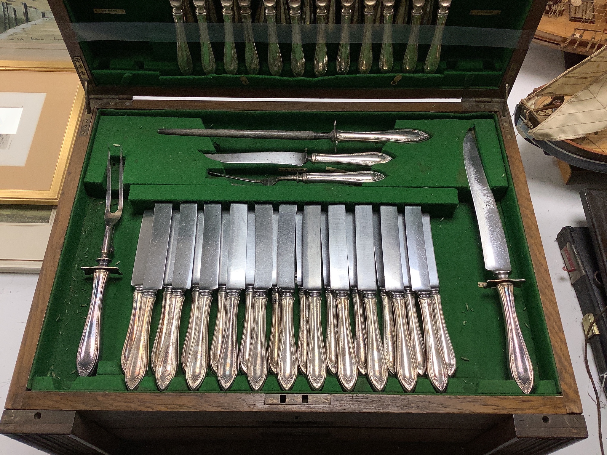 A set of three silver menu holders and a part service of Community Plate, in 1930's oak table canteen